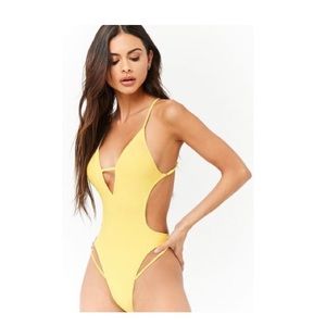 Plunging yellow one piece bathing suit